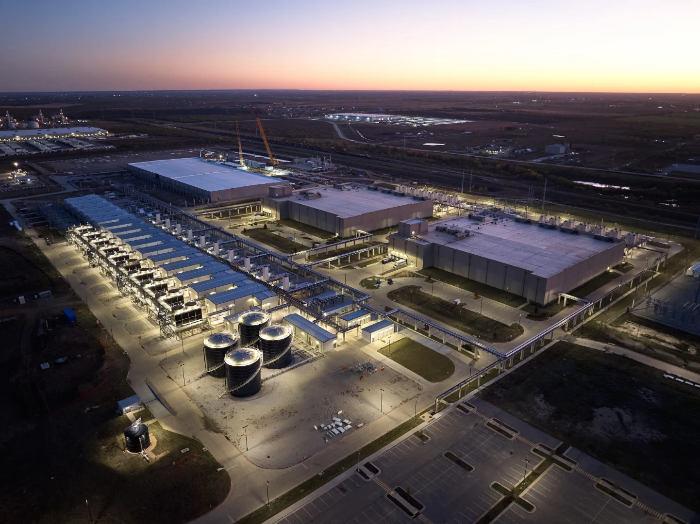 Aerial view of an operating data-centre campus at dusk